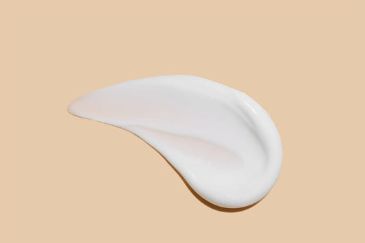 Lash lift adhesive being applied with a brush to a silicone pad