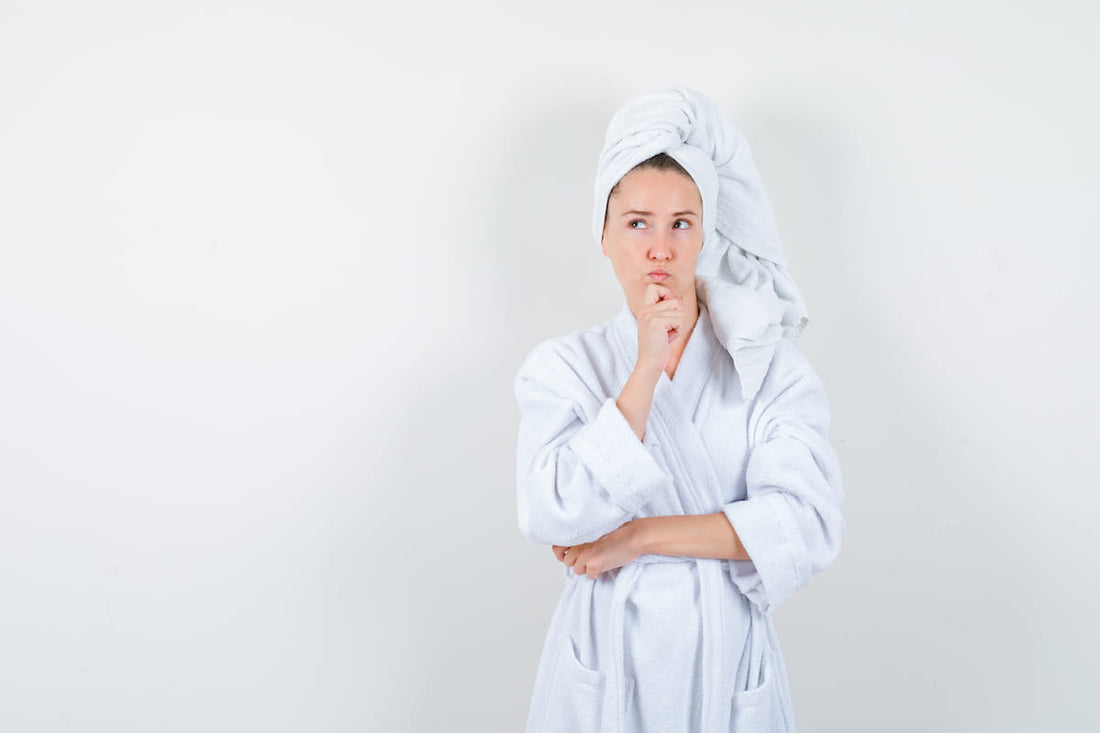 Woman using an LED light therapy face mask during a skincare session